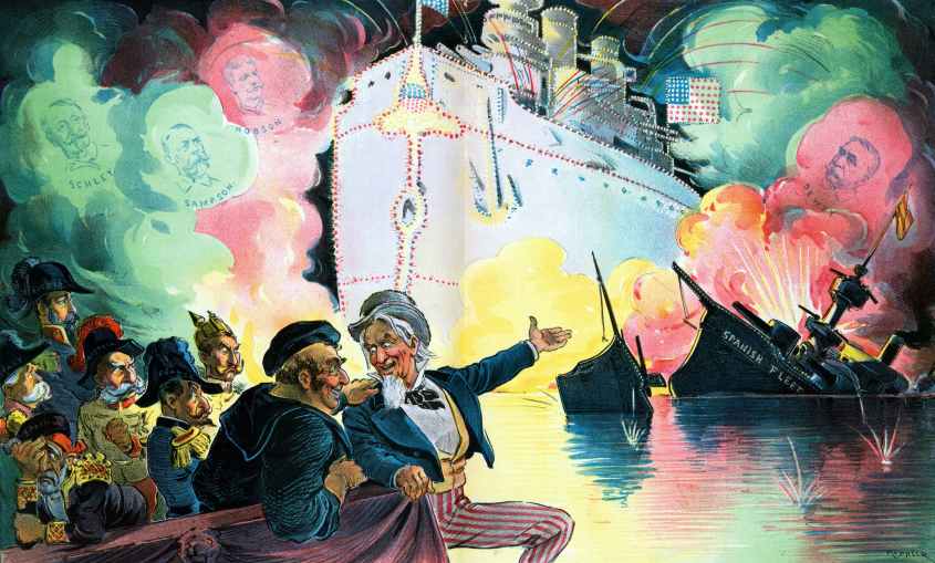 Celebrating July 4th, 1898, "the triumph of the American battle-ship" by Udo Keppler, 1872-1956, artist, 1898. Uncle Sam sitting with John Bull, who is a sailor representing England, and six figures representing "Spain", "Italy" (Umberto I), "Austria" (Franz Joseph I), "France", Germany (William II), and "Russia" (Nicholas II), watching a fireworks display that shows the outline of a huge American battleship that illuminates the ruins of the "Spanish Fleet", and in the clouds of smoke shows portraits of "Schley, Sampson, Hobson and Dewey". (Photo by: Universal History Archive/Universal Images Group via Getty Images)