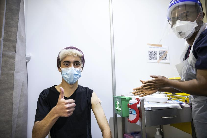 A man gets his vaccine.