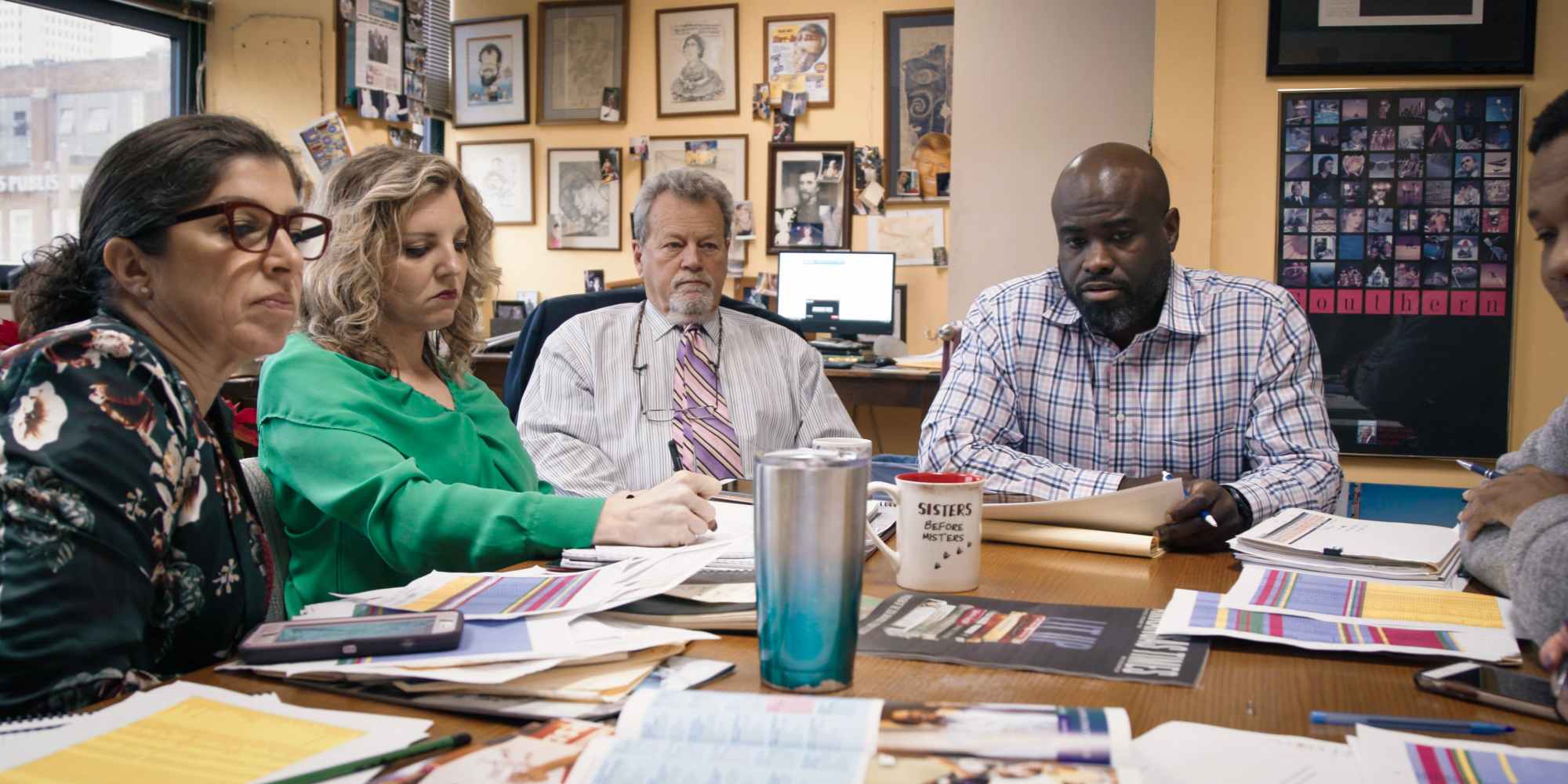 Alan Leveritt, center, and staff members of the Arkansas Times meet at their office. The publication sued the state of Arkansas over its anti-BDS legislation. The case could end up before the U.S. Supreme Court.
