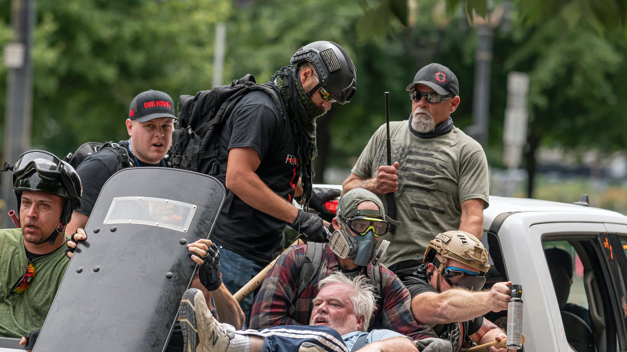 Far-right extremists leave Portland, Ore., after clashing with antifascists on Aug. 7, 2021.