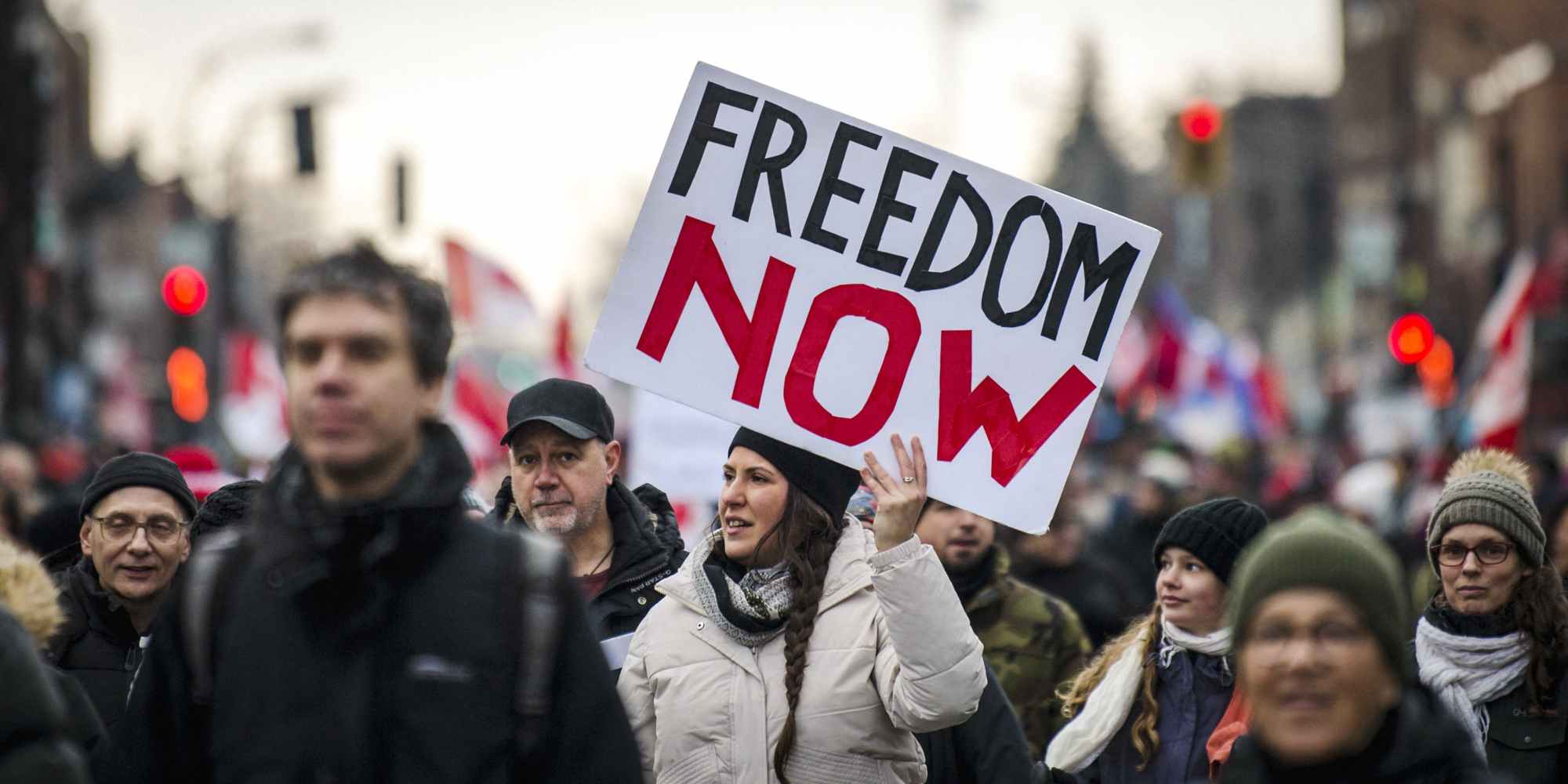Demonstrators march to support the Trucker Convoy protesting Covid-19 mandates, in Montreal on February 12, 2022. - Mandate protests and support for the truckers in Canada have spread from Ottawa. to Windsor to Montreal, and Toronto. (Photo by Andrej Ivanov / AFP) (Photo by ANDREJ IVANOV/AFP via Getty Images)