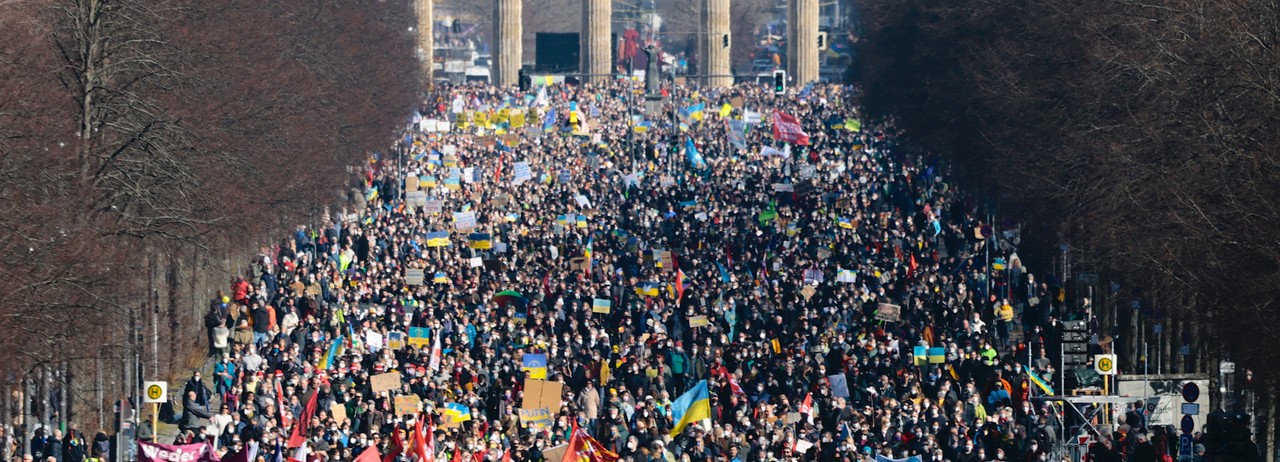Anti-war demonstrators march in a Berlin street.