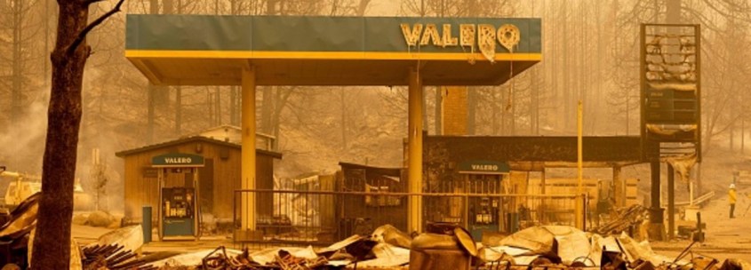 A burned Valero gas station smolders during the Creek fire in an unincorporated area of Fresno County, California on September 8, 2020.
