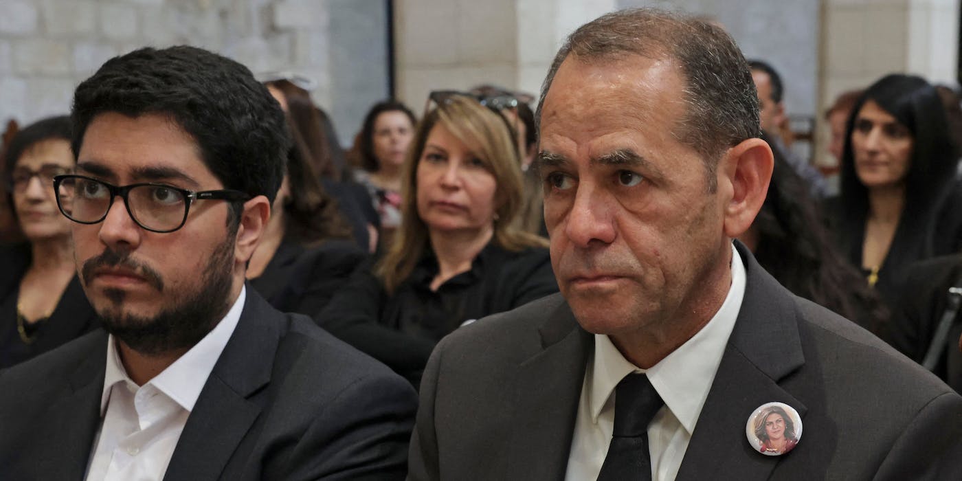 The late journalist's brother Anton Abu Akleh (R) attends a mass held for slain al-Jazeera reporter Shireen Abu Akleh at the the Church of the Nativity in the West Bank biblical city of Bethlehem on May 16, 2022. (Photo by HAZEM BADER / AFP) (Photo by HAZEM BADER/AFP via Getty Images)