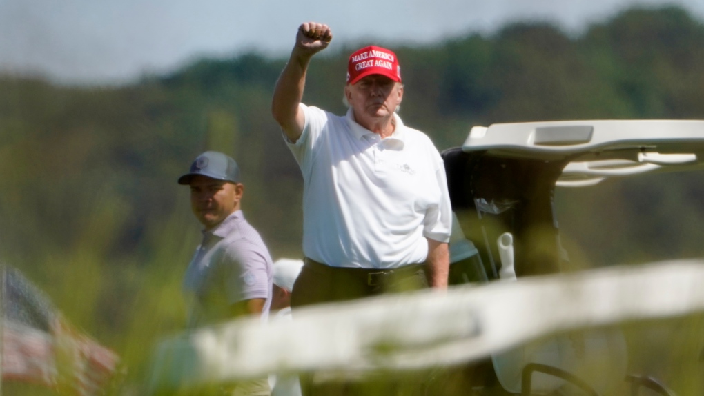 Former U.S. President Donald Trump gestures while playing golf at Trump National Golf Club in Sterling, Va., on Tuesday, Sept. 13, 2022. (AP Photo/Manuel Balce Ceneta)