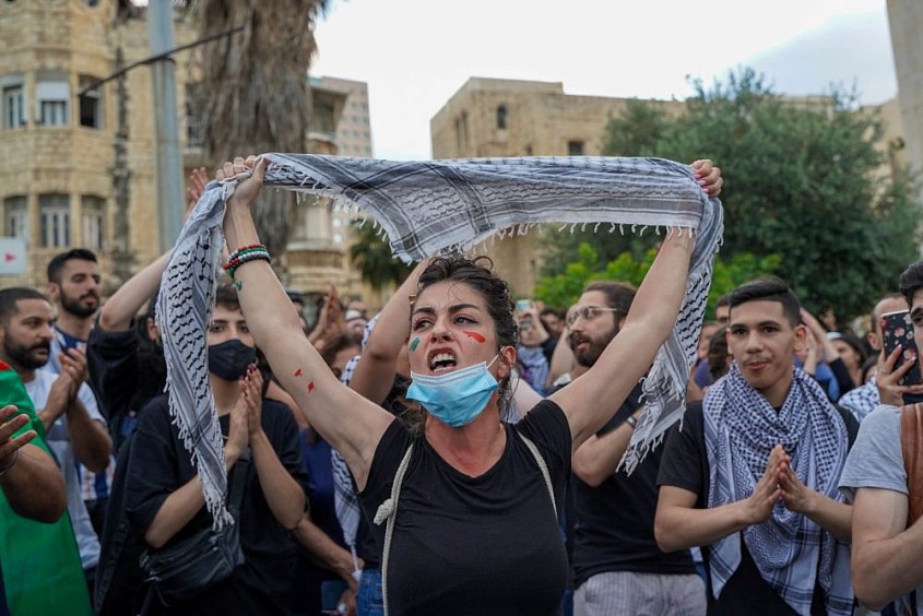Palestinians demonstrate in Haifa during a general strike to protest Israeli state violence against Palestinians, May 18, 2021. (Maria Zreik/Activestills.org) Palestinians demonstrate in Haifa during a general strike to protest Israeli state violence against Palestinians, May 18, 2021. (Maria Zreik/Activstills.org)