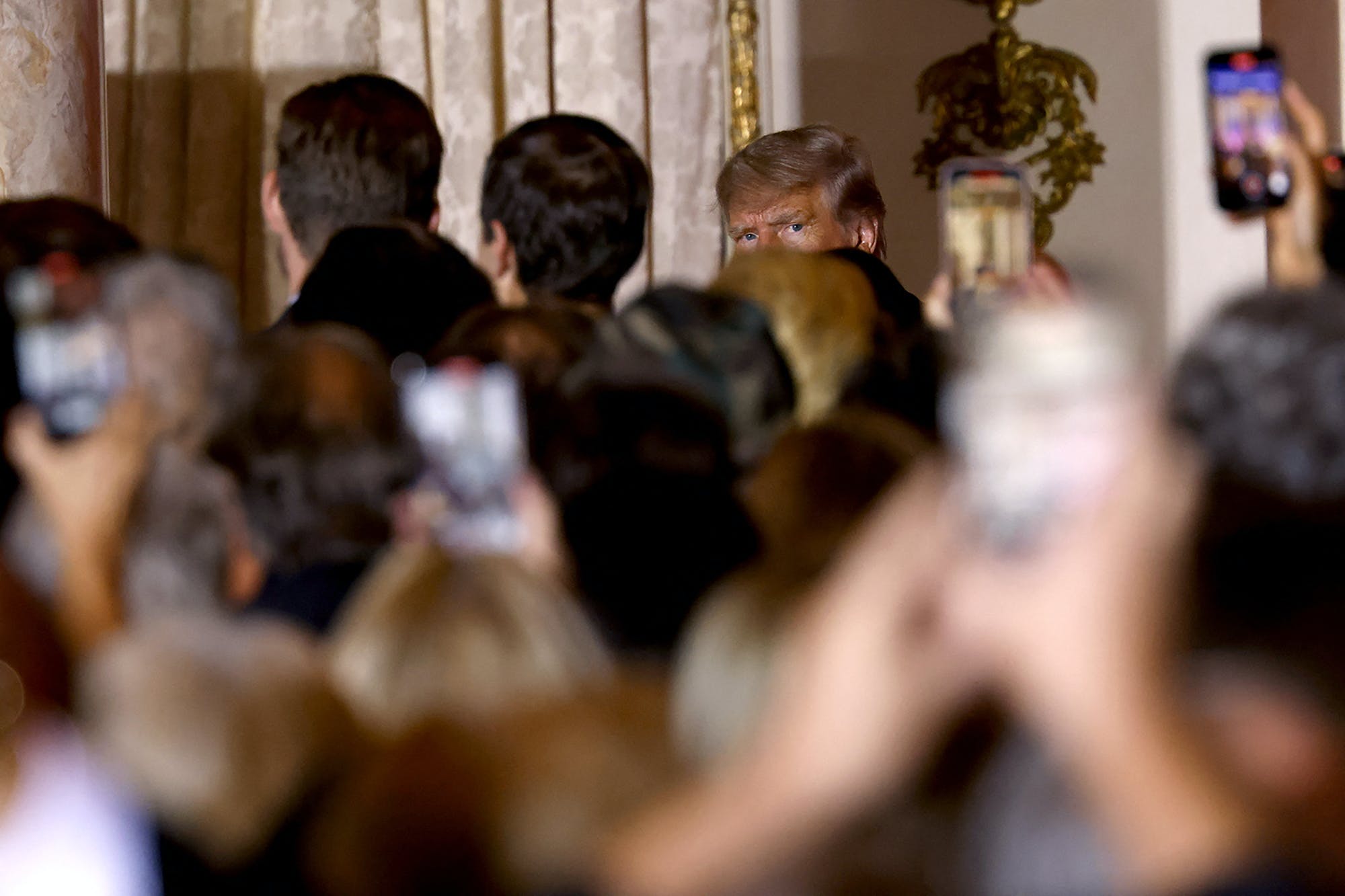 Former US President Donald Trump departs after speaking at the Mar-a-Lago Club in Palm Beach, Florida, on November 15, 2022. - Donald Trump pulled the trigger on a third White House run on November 15, setting the stage for a bruising Republican nomination battle after a poor midterm election showing by his hand-picked candidates weakened his grip on the party. Trump filed his official candidacy papers with the US election authority moments before he was due to publicly announce his candidacy. (Photo by ALON SKUY / AFP) (Photo by ALON SKUY/AFP via Getty Images)