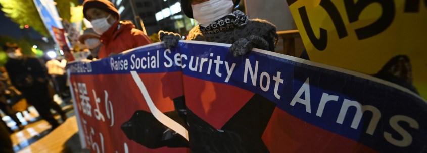 People gather in front of Japanese Prime Minister Fumio Kishida's office in Tokyo on December 9, 2022 to protest the government's plan to double military spending.