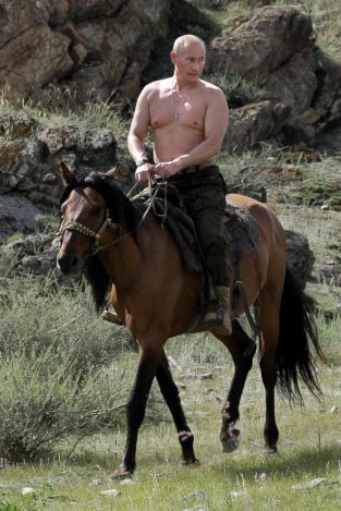 Shirtless Vladimir Putin takes dip in icy Russian lake for ...