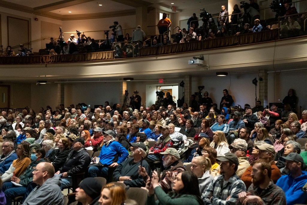 Residents listen as environmental activist Erin Brockovich speaks during a town hall at East Palestine High School on February 24, 2023 in East Palestine, Ohio.
