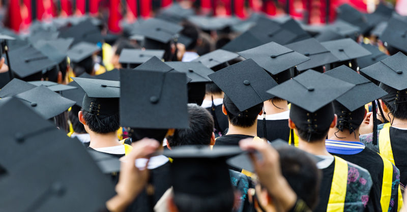 Back view of graduates during commencement.