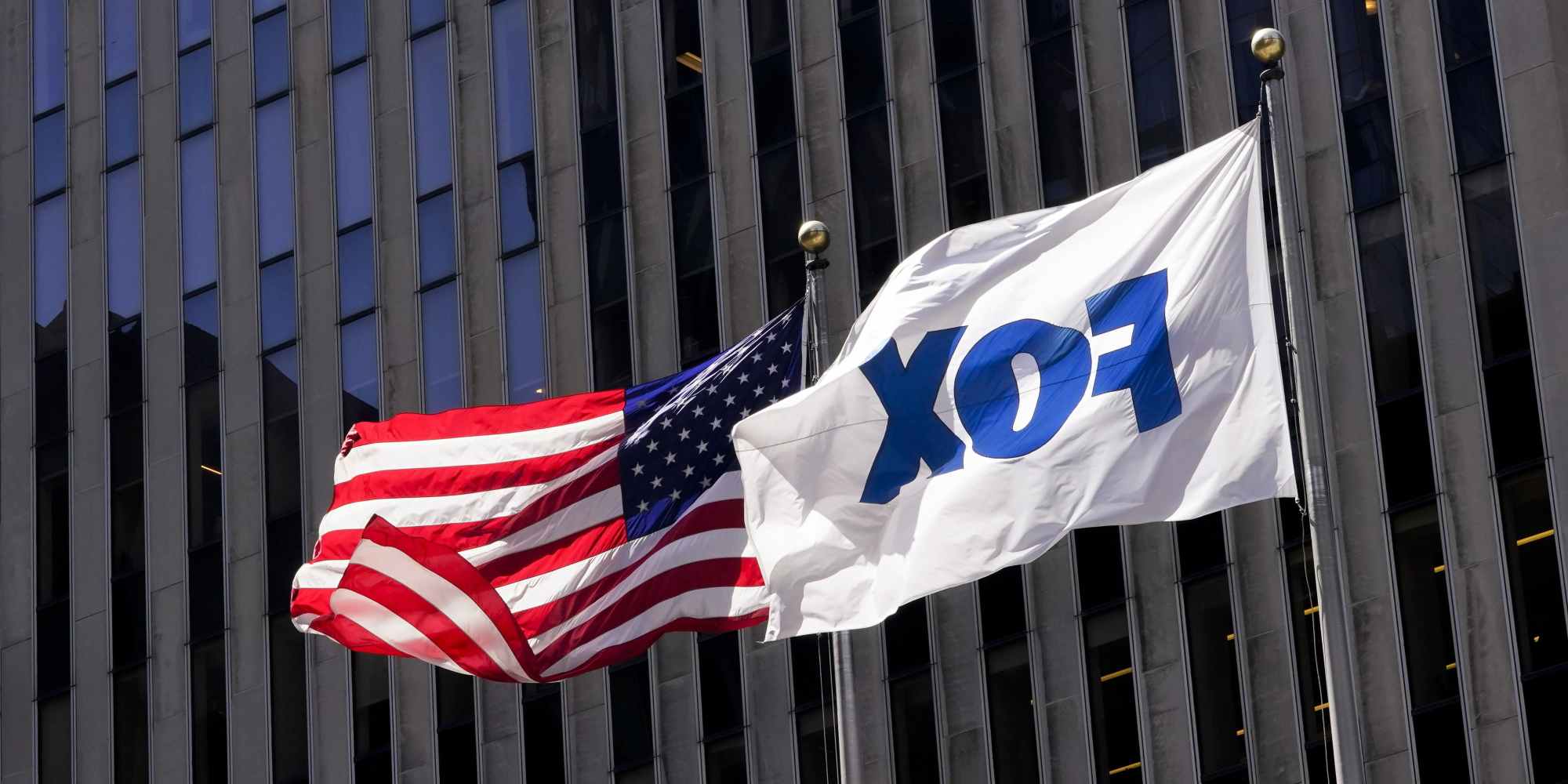 The American and Fox flags fly outside the News Corp. Building and Fox News Headquarters, Wednesday, April 19, 2023, in New York. Fox News’ nearly $800 million settlement of a voting machine company's defamation lawsuit marks the first milestone in a larger legal strategy designed to combat the false claims and conspiracy theories about elections that have rippled through the United States for nearly three years. (AP Photo/Mary Altaffer)