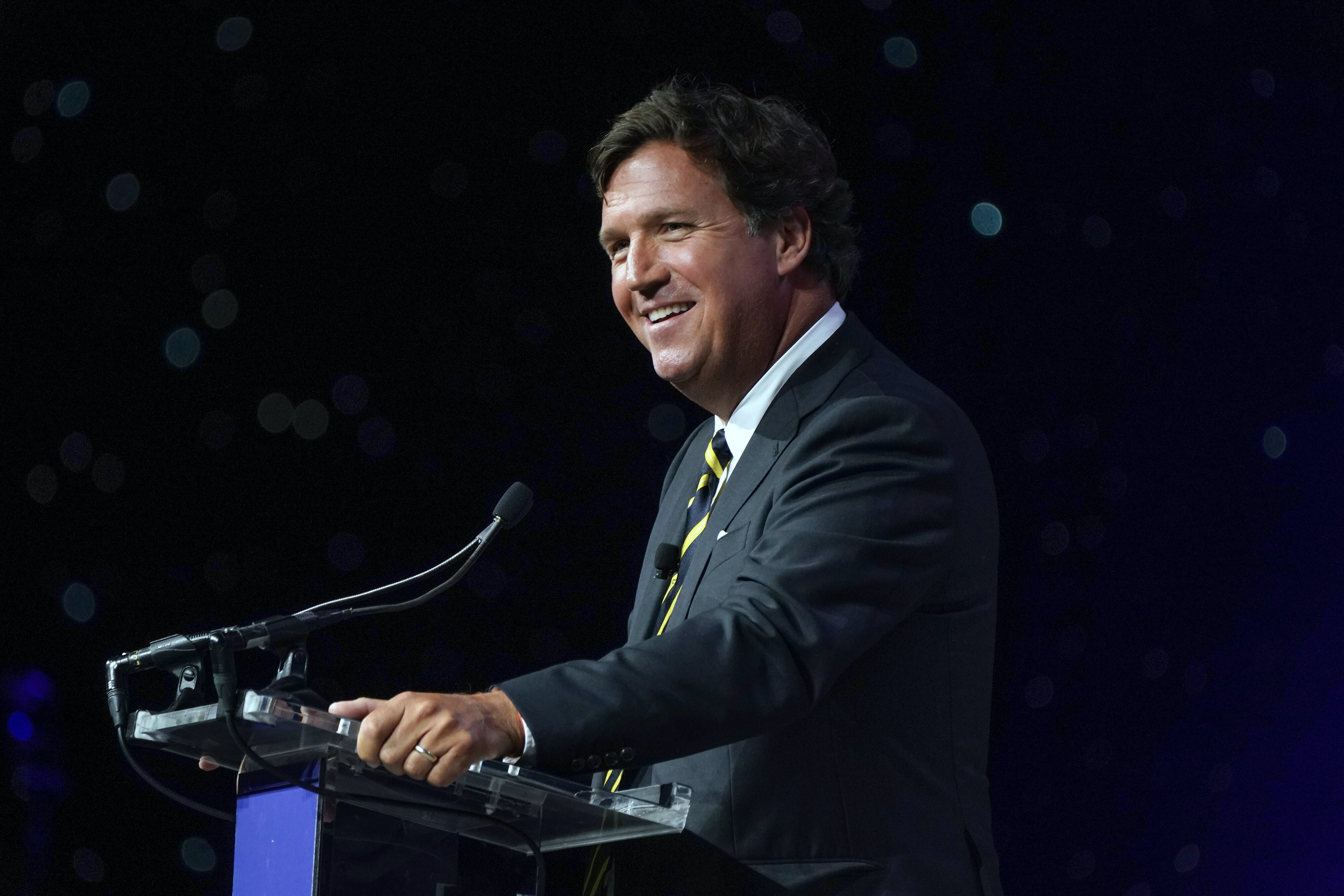 FILE -- Tucker Carlson speaks in National Harbor, Md., on April 21, 2023. Fox News said Monday, April 24, 2023, that it is parting ways with Carlson, its most popular prime time host who was also the source of repeated controversies and headaches for the network because of his statements on everything from race relations to LGBTQ rights. (Leigh Vogel/The New York Times)