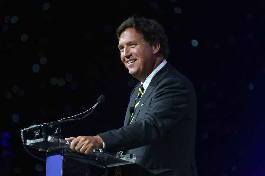 FILE -- Tucker Carlson speaks in National Harbor, Md., on April 21, 2023. Fox News said Monday, April 24, 2023, that it is parting ways with Carlson, its most popular prime time host who was also the source of repeated controversies and headaches for the network because of his statements on everything from race relations to LGBTQ rights. (Leigh Vogel/The New York Times)