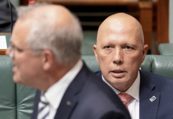 Peter Dutton looks at Scott Morrison