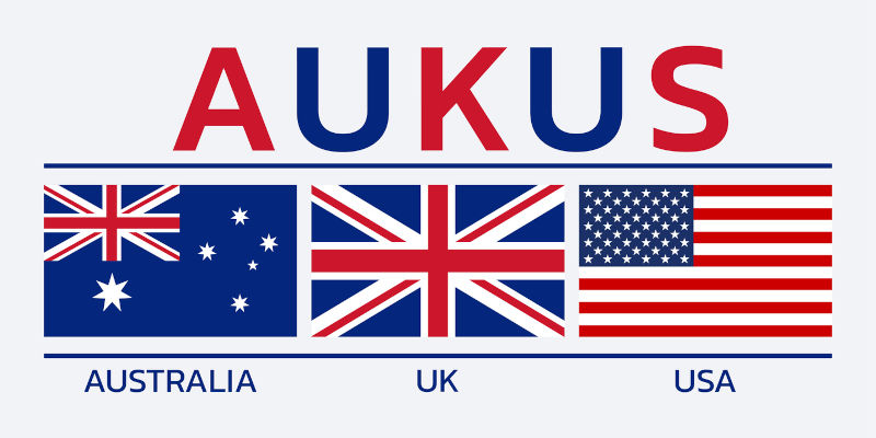 AUKUS banner with USA, UK, Australia flag icons.
