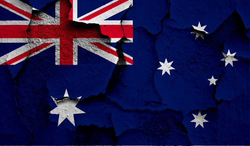 Flag of Australia on old grunge wall in background