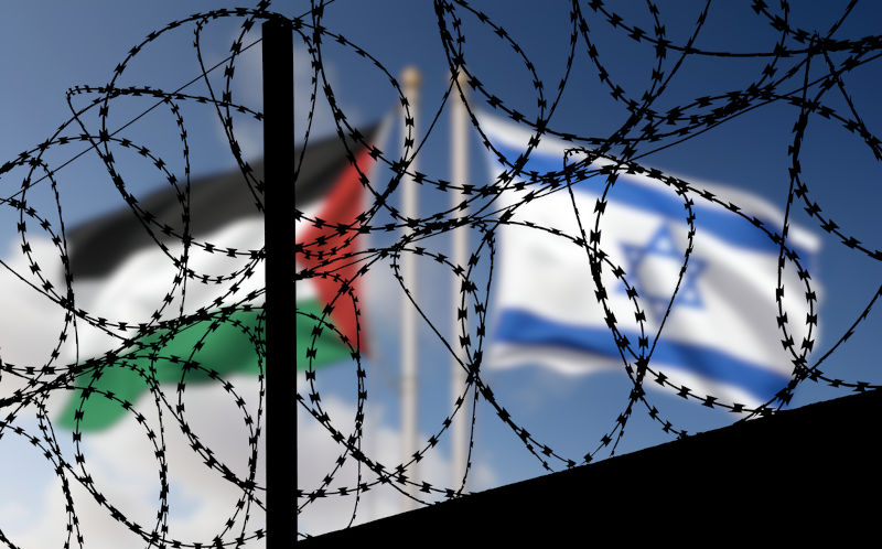 Flags of Israel and Palestine behind the barbed wire.