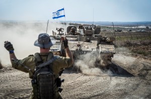 14 October 2023, Israel, Sderot: Israeli military combat vehicles and tanks are seen near the Israeli-Gaza border as fighting between Israeli troops and the militants of the Palestinian group Hamas continues. Photo: Ilia Yefimovich/dpa (Photo by Ilia Yefimovich/picture alliance via Getty Images)