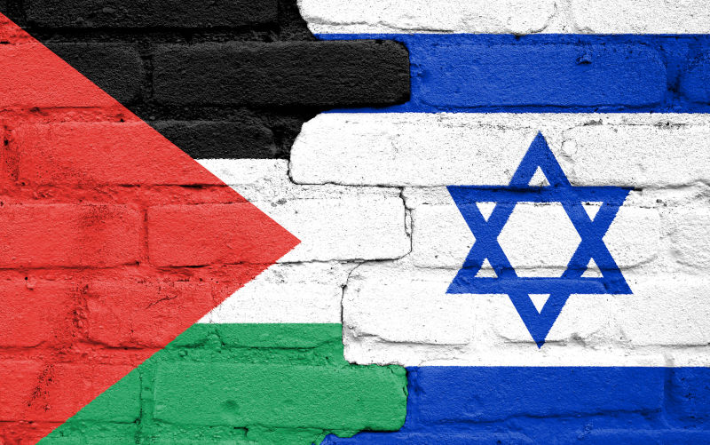 Flags-of-Israel-and-Palestine-painted-on-the-brick-wall.-Gaza-and-Israel-conflict. Image: iStock / t:Tomas Ragina Flags of Israel and Palestine painted on the brick wall. Gaza and Israel conflict
