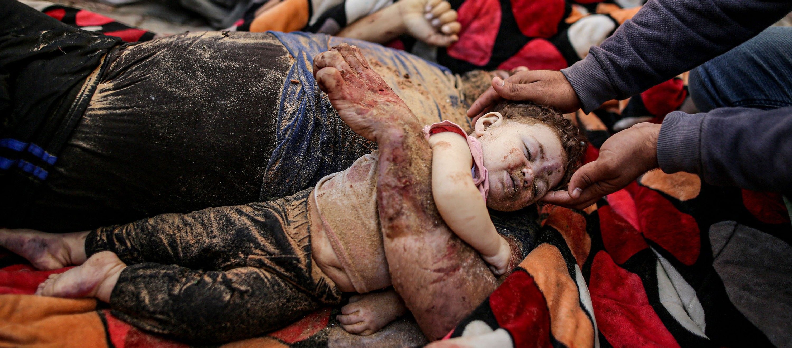 Gazan father Muhammed Gouda and his baby daughter Misk lay dead at  Aqsa Hospital