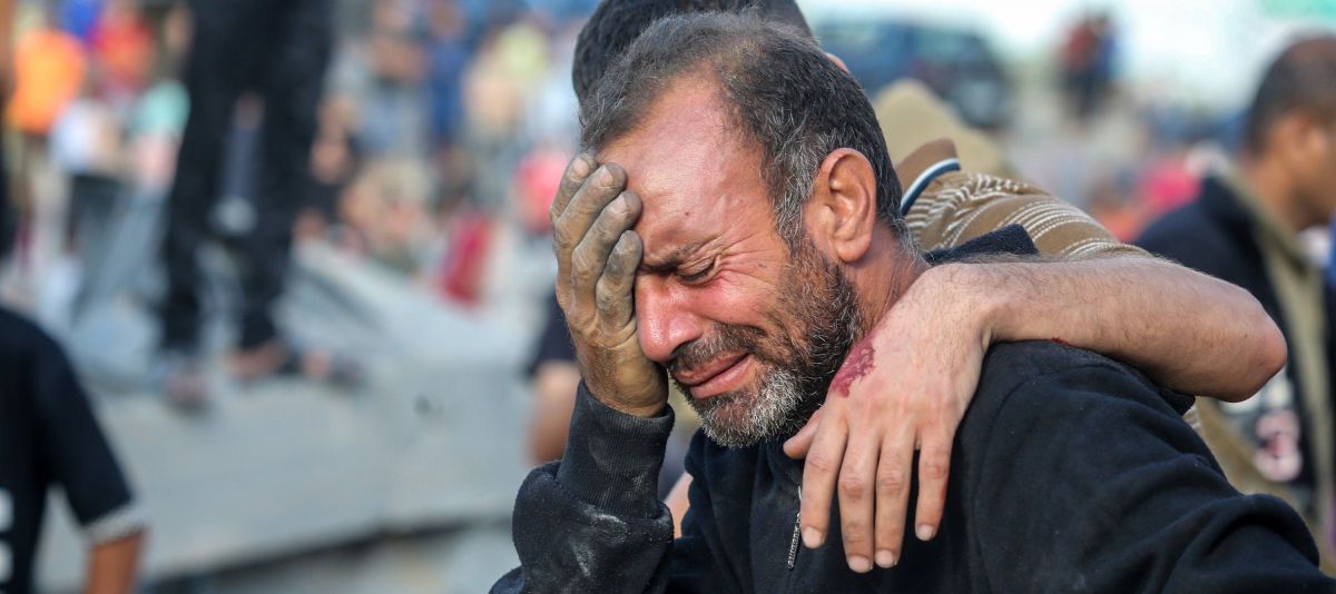 A man weeps after his home was razed by Israeli strikes in Khan Younis