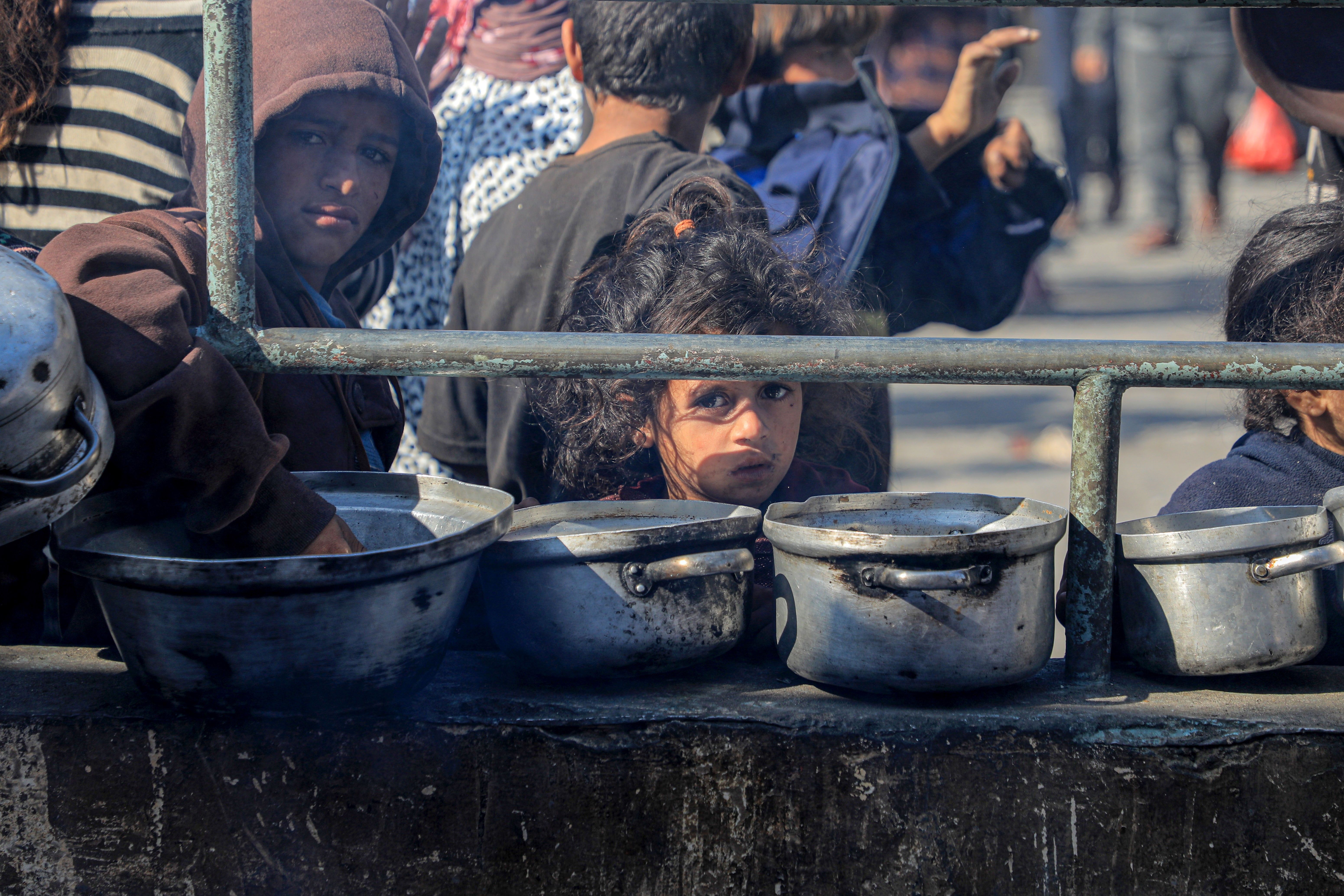 Children wait for food relief
