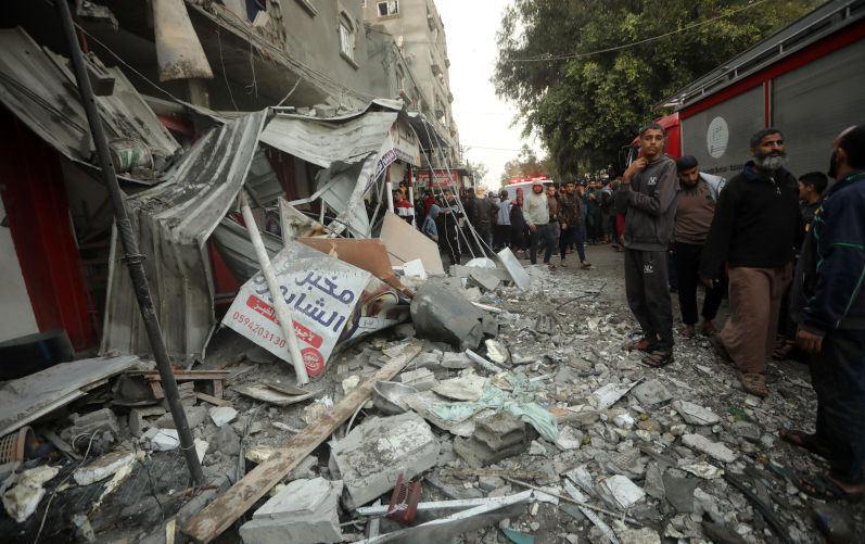 Rafah, Gaza. 12th Dec, 2023. Palestinians gather following Israeli bombardment in Rafah in the southern Gaza on Tuesday, December 12, 2023. At least 22 people have been reportedly killed, including seven children, in the bombing by Israel in Rafah on Tuesday. Global calls for a ceasefire have been ignored by Israel and the United States, as humanitarian aid operations have collapsed warning of starvation and disease amongst the Gaza population. Image: Alamy/ Ismael Mohamad/UPI Credit: UPI/Alamy Live News