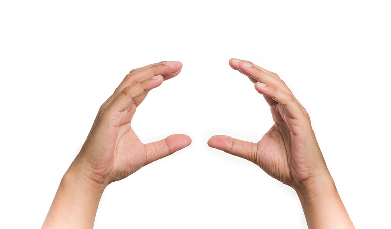 Human hands gesture holding sandwich on isolated background. Image :iStock/JuYochi