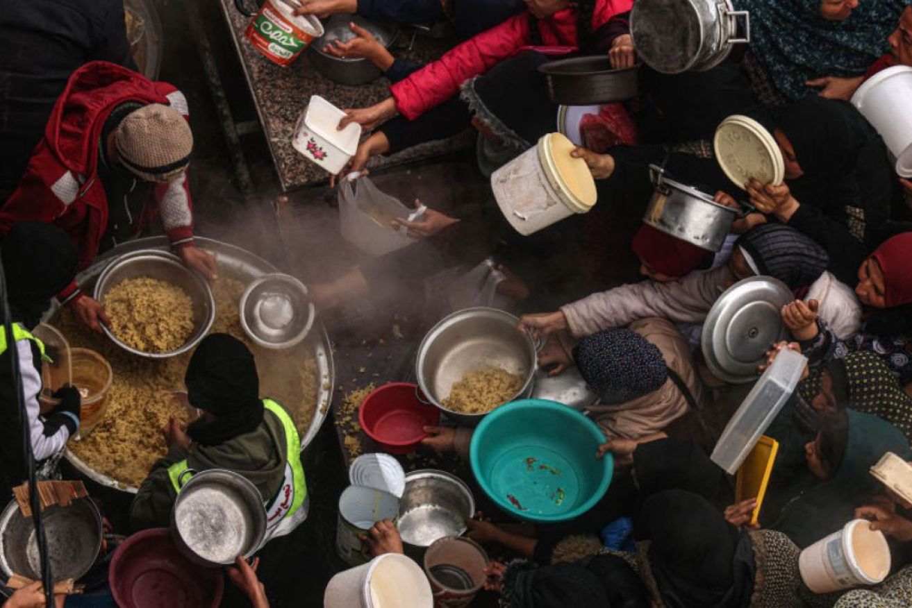 All the 2.3 million people in Gaza rely on "woefully inadequate" food aid to survive, a senior UN aid official has told the Security Council.