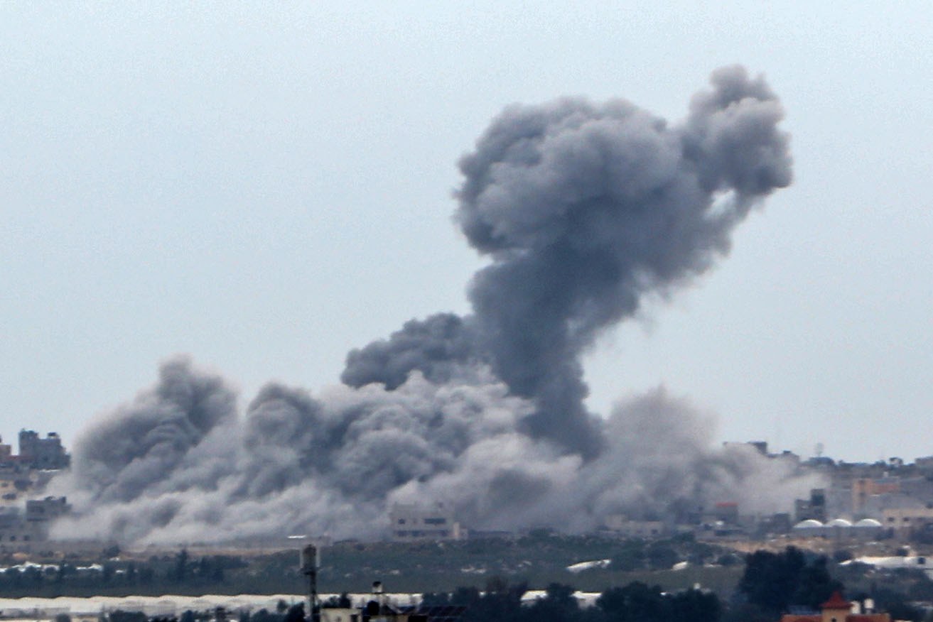 Smoke rises from the Khan Yunis district as Israeli attacks continue at Rafah.