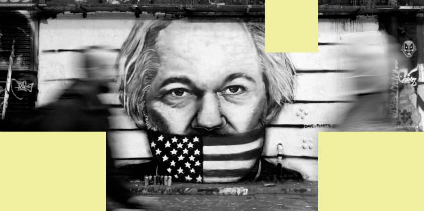 LONDON, UNITED KINGDOM - 2024/02/19: People walk by a graffiti depicting Julian Assange on Leake Street. A graffiti is seen at Leake Street, the famous graffiti tunnel in central London, painted by street artist Dave Paint, depicting Julian Assange, who is due for the final hearing at Royal Court of Justice in London on 20th Feb 2024 regarding on the decision to be extradited to US for the charges of exposing the diplomatic and military policy in the Afghan and Iraq wars through WikiLeaks. (Photo by Hesther Ng/SOPA Images/LightRocket via Getty Images)