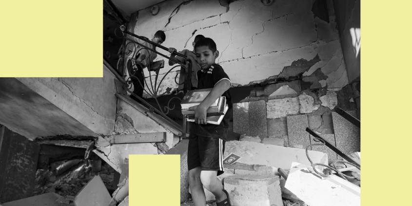 Palestinian kids take religious books out of a mosque destroyed in an Israeli air strike in Khan Younis, Gaza Strip, Sunday, Oct.8, 2023.