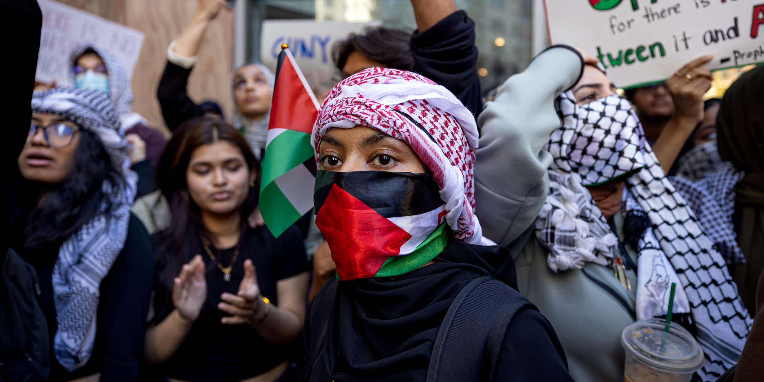 NEW YORK, UNITED STATES - 2023/10/12: Students from Hunter College chant and hold up signs during a pro-Palestinian demonstration at the entrance of their campus. The pro-Palestinian student organization Students for Justice In Palestine (SJP) held protests in colleges across the nation to show solidarity with Palestine. On October 7 the Palestinian militant group Hamas launched a large-scale surprise attack from Gaza, launching thousands of missiles and sending at least 1,500 fighters by land, sea and air into Israel. At least 1,300 Israelis have been confirmed killed and 150 kidnapped. 1,203 Palestinians in Gaza are also confirmed killed. The attack is prompting retaliatory strikes by Israel on Gaza and a declaration of war by the Israeli prime minister. (Photo by Michael Nigro/Pacific Press/LightRocket via Getty Images)