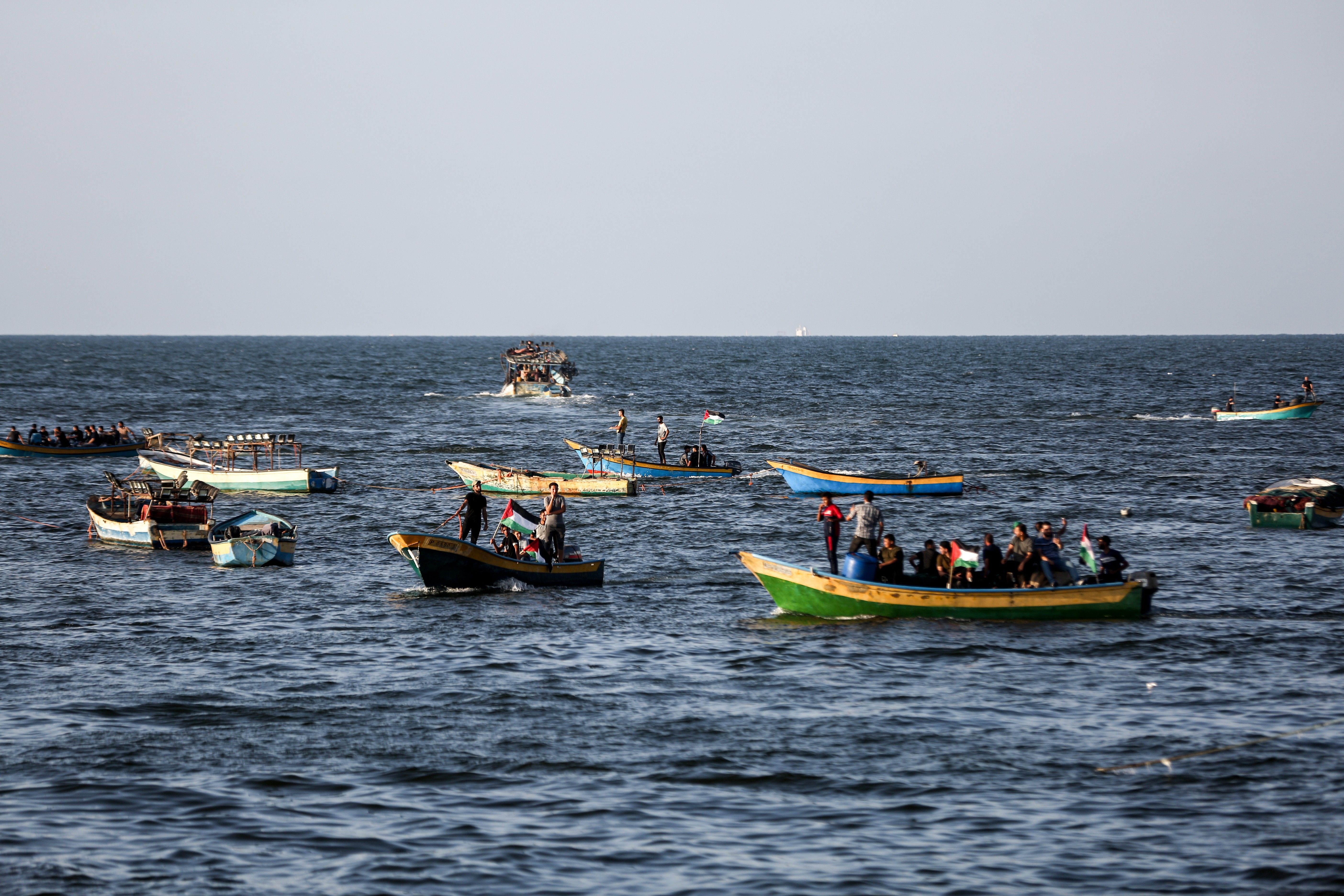 Palestinians protest in boats off Gaza coast.