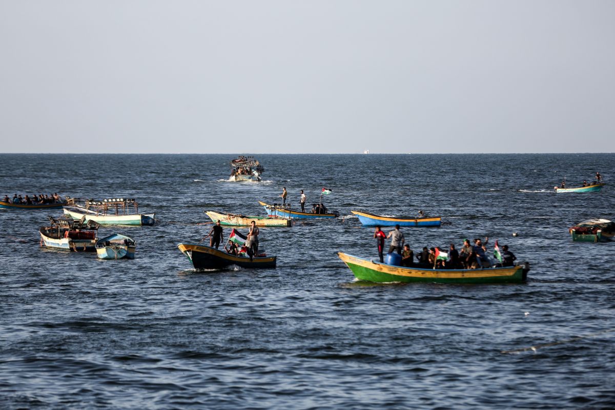 Palestinians protest in boats off Gaza coast.