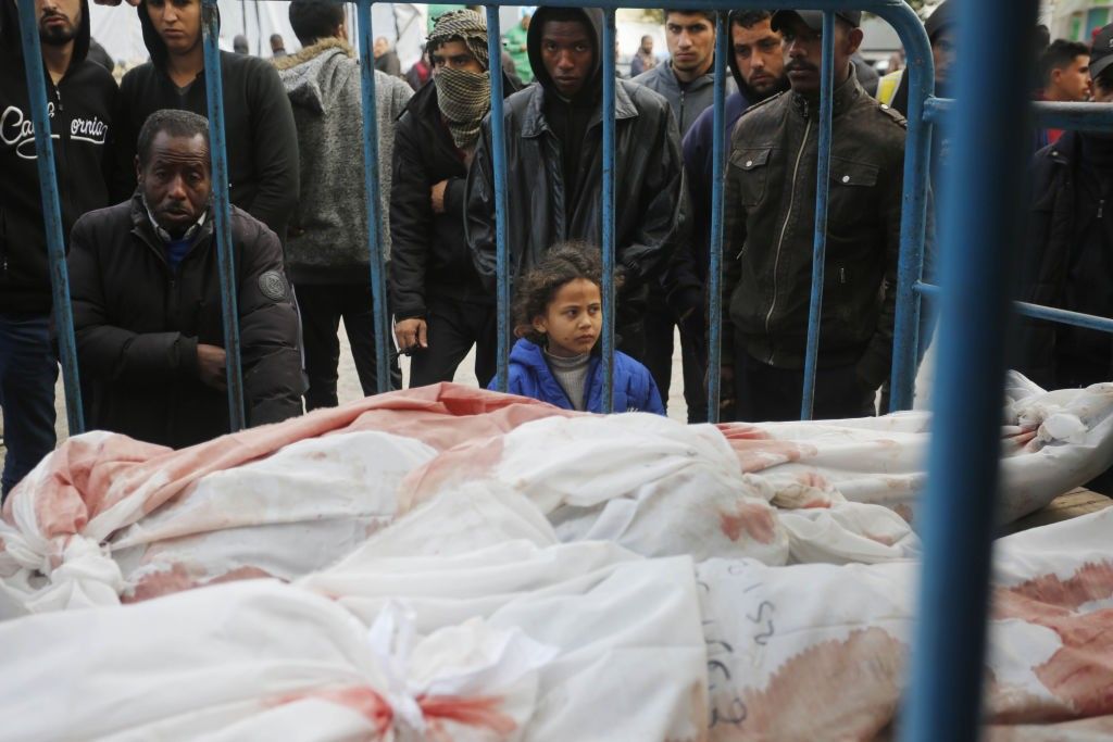 Relatives of Palestinians killed in the Israeli war on Gaza mourn 