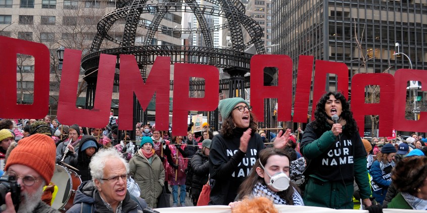 Pro-Palestine demonstrators hold placards that say, "Dump AIPAC," at a rally. Demonstrators marched in Manhattan, New York City condemning the pro-Israel lobbying group, the American Israel Public Affairs Committee, or AIPAC. Protestors opposed AIPAC for influencing U.S. policies to support the Israel Defense Forces' military operations in Gaza. Demonstrators also protested against New York senators Chuck Schumer and Kirsten Gillibrand for supporting Israel's war against Hamas. On Tuesday, the United Nations food agency, the World Food Program, paused food shipments to northern Gaza due to chaos in the area and Israeli bombardment. According to Gaza's Health Ministry, more than 29,000 people have been killed in Gaza since the war started on October 7, 2023. (Photo by Jimin Kim / SOPA Images/Sipa USA)(Sipa via AP Images)