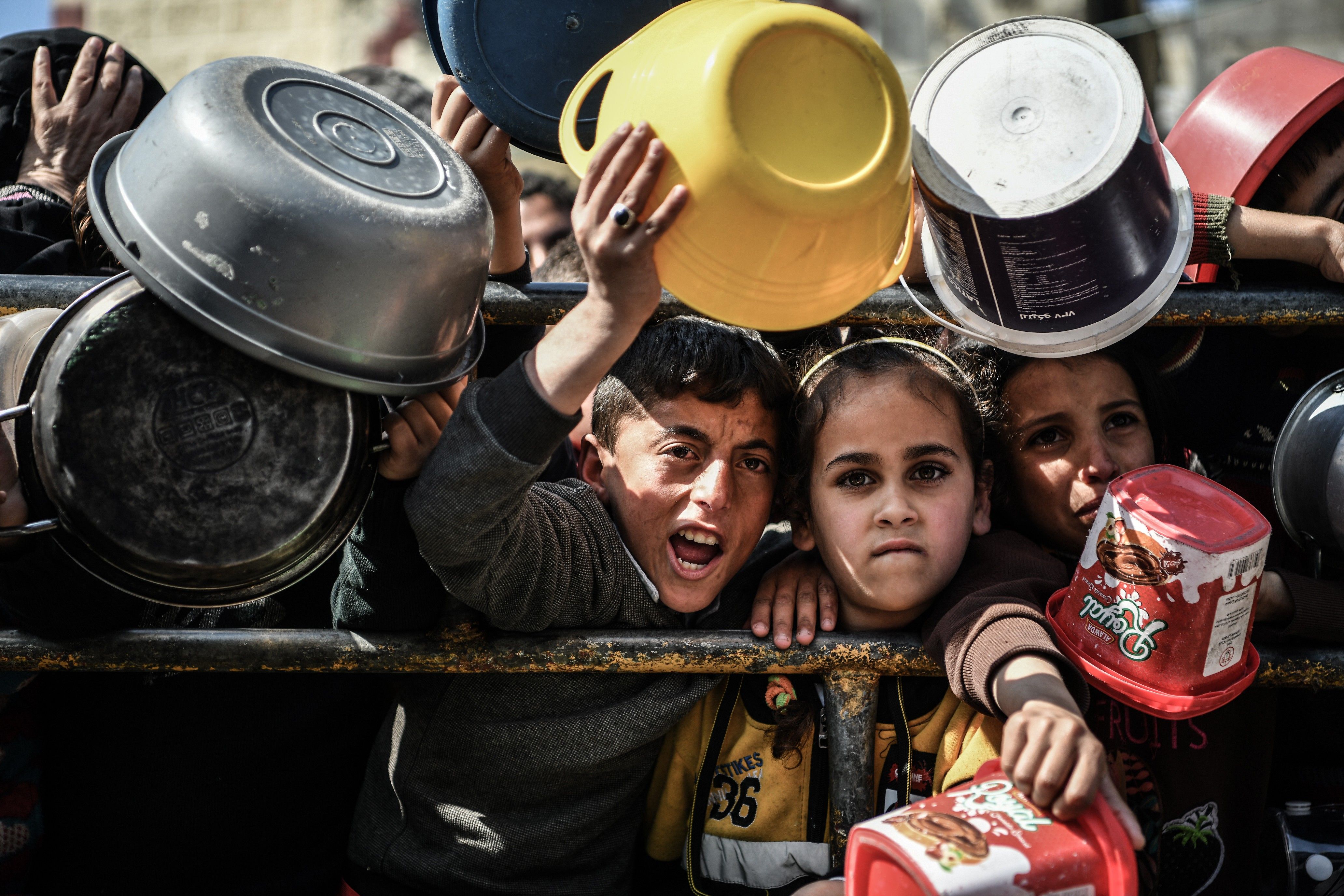 Children wait for food in Rafah.