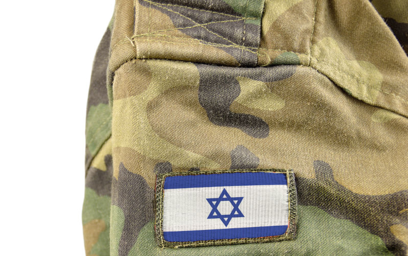Cropped closeup shot of a Israel flag on a soldier's uniform with white background