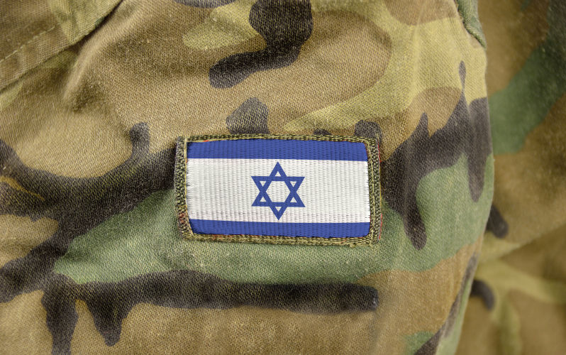Cropped closeup shot of a Israel flag on a soldier's uniform