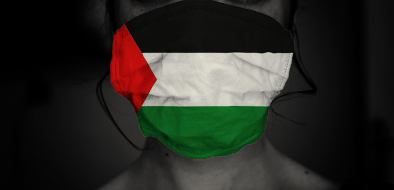 A woman wears a mask with Palestine flag. Save gaza concept Image:iStock/ ninitta