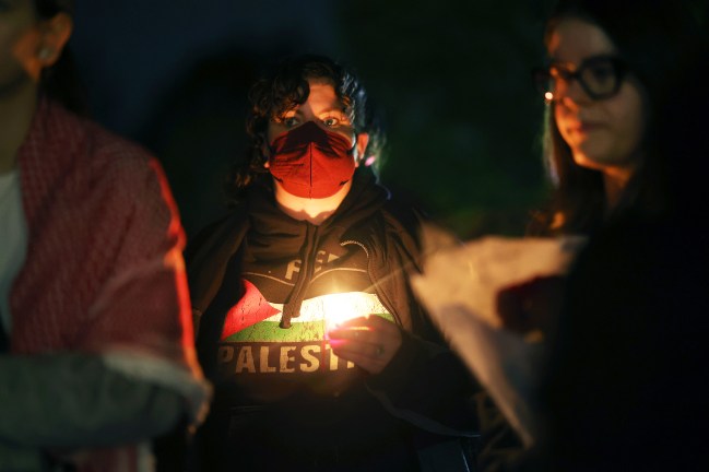 PLAINFIELD, ILLINOIS - OCTOBER 17: An overflow crowd listens from outside as community members filled the Prairie Activity and Rec Center for a vigil for 6-year-old Palestinian-American Wadea Al-Fayoume on October 17, 2023 in Plainfield, Illinois. Al-Fayoume was stabbed to death Saturday by his landlord. His mother, Hanaan Shahin, also suffered more than a dozen stab wounds in the attack and remains hospitalized. Police have said that the family was attacked because of their Muslim faith. More than a thousand people attended the vigil.  (Photo by Scott Olson/Getty Images)
