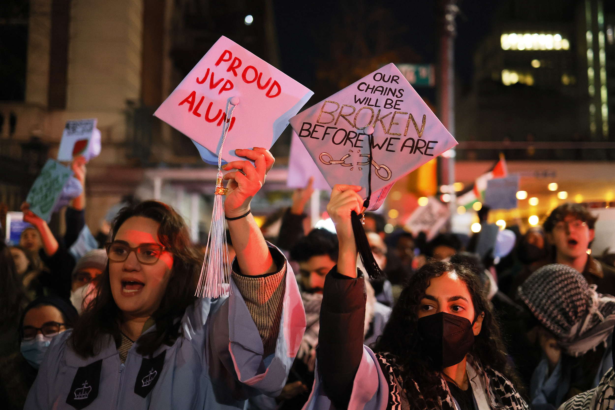 NEW YORK, NEW YORK - NOVEMBER 20: People gather to protest the banning of Students for Justice in Palestine (SJP) and Jewish Voice for Peace (JVP) at Columbia University on November 20, 2023 in New York City. Students, alumni of both schools, some dressed in caps and gowns, and supporters held a "Denouncement Ceremony" and pledged not to donate money to the schools after the banning of the student groups for holding a nonviolent but unsanctioned protest demanding a ceasefire in Gaza. More than 20 progressive elected officials have sent a letter to the university calling for the reinstatement of the groups. Calls for a ceasefire in Gaza continue as the death toll from Israel’s invasion of Gaza has increased in the weeks since the October 7 Hamas attack. (Photo by Michael M. Santiago/Getty Images)