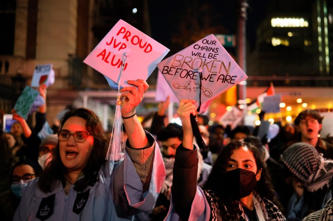 NEW YORK, NEW YORK - NOVEMBER 20: People gather to protest the banning of Students for Justice in Palestine (SJP) and Jewish Voice for Peace (JVP) at Columbia University on November 20, 2023 in New York City. Students, alumni of both schools, some dressed in caps and gowns, and supporters held a "Denouncement Ceremony" and pledged not to donate money to the schools after the banning of the student groups for holding a nonviolent but unsanctioned protest demanding a ceasefire in Gaza. More than 20 progressive elected officials have sent a letter to the university calling for the reinstatement of the groups. Calls for a ceasefire in Gaza continue as the death toll from Israel’s invasion of Gaza has increased in the weeks since the October 7 Hamas attack. (Photo by Michael M. Santiago/Getty Images)