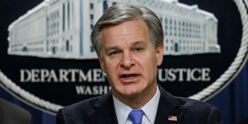 WASHINGTON, DC - DECEMBER 6: FBI Director Christopher Wray speaks during a press conference at the U.S. Department of Justice on December 6, 2023 in Washington, DC. The Department of Justice announced today that four Russian military personnel have been indicted for war crimes committed against a U.S. national living in Ukraine, the first of such charges ever to be brought under the U.S. war crimes statute. (Photo by Samuel Corum/Getty Images)
