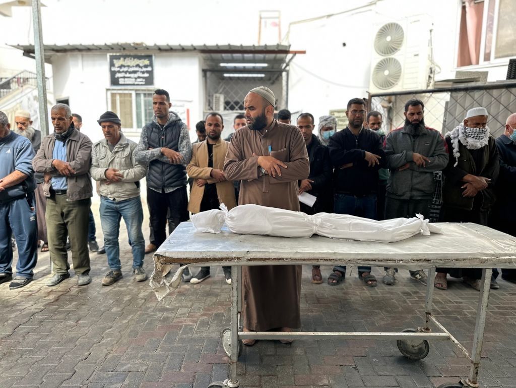Palestinians pray for Yazan al-Kafarneh, a 10-year-old Gaza boy who died from severe malnutrition.