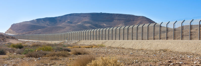 The border fence between Israel (Negev Desert) and Egypt (Sinai Desert)