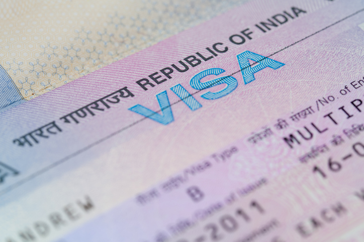 A closeup of an Indian business visa vignette inside a passport. Image:iStock/xrrr