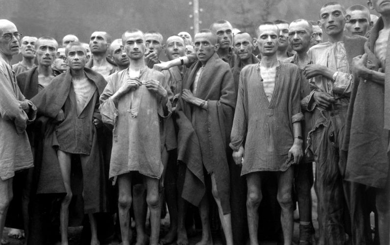 Starved prisoners, nearly dead from hunger, pose in concentration camp in Ebensee, Austria. The camp was reputedly used for 